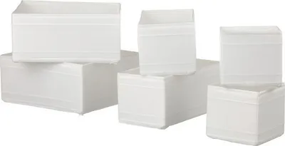 A set of white fabric storage boxes.