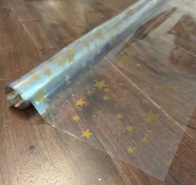 Produktbild von PVC Tischdecke Klarsicht Sterne gold Weihnachten· Eckig · Länge & Breite wählbar· abwaschbare Tischdecke · transparente Folie mit Druck Ofek gold, Größe:140 x 2500 cm