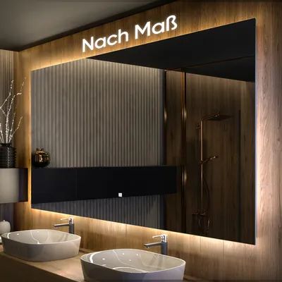 A modern bathroom with a large illuminated mirror above two sinks.