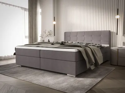 A bedroom scene featuring a large bed.