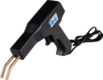 A black plastic welding gun with gold colored prongs is shown against a white background.