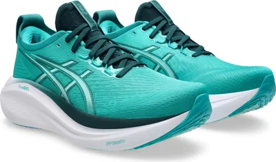 A pair of teal and green ASICS running shoes on a white background.