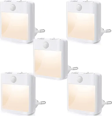 A group of five white LED night lights with motion sensors, plugged into an unseen power source.