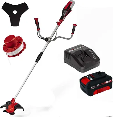 A cordless grass trimmer with accessories, battery, and charger, displayed against a white background.