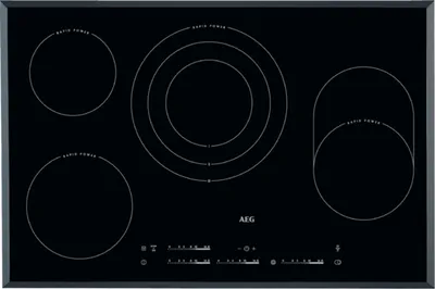 A top-down view of a black induction hob with four cooking zones and control panel.