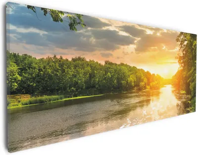 Produktbild von Wallario Premium Leinwandbild Sonnenuntergang am Fluss in grüner Umgebung in Größe 30 x 75 cm