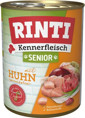 A can of dog food with an image of raw meat and vegetables.