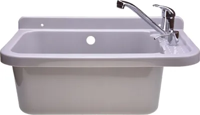 A gray sink with a chrome faucet and soap dispenser, mounted on a white wall.
