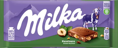A Milka chocolate bar with hazelnuts on its packaging.