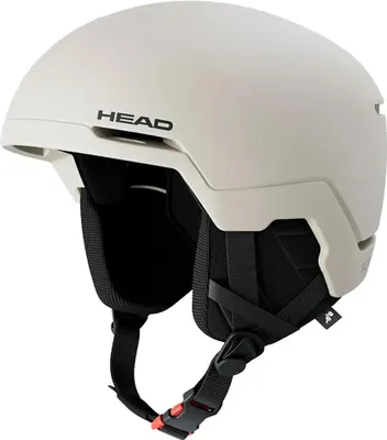 A beige ski helmet with black straps and padding.