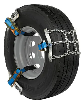 A close-up of a truck tire with snow chains attached.