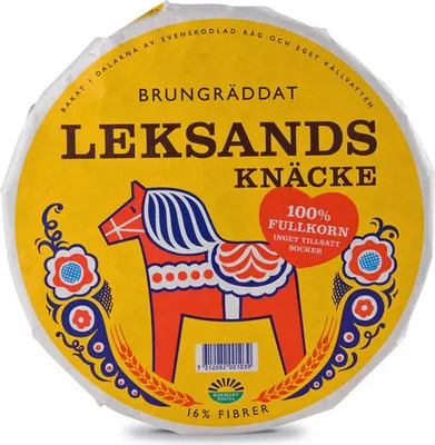 A round package of Leksands Knäcke, featuring a traditional Swedish Dala horse illustration and product information.