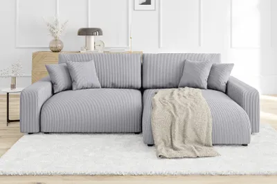 A modern living room with a gray sectional sofa.