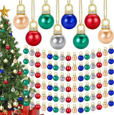 A Christmas tree decorated with ornaments and a collection of mini Christmas ball ornaments.