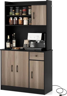 A black and wood-grain kitchen cabinet with storage shelves, a coffee maker, and bottles on display.