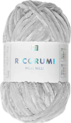 A ball of light gray yarn with a label wrapped around it.