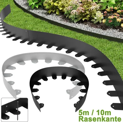 Several pieces of black and gray metal garden edging are displayed in a curved arrangement on a grassy lawn, with a garden bed in the background.