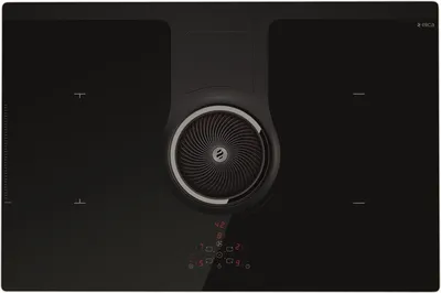A top-down view of a black induction cooktop with an integrated ventilation system.