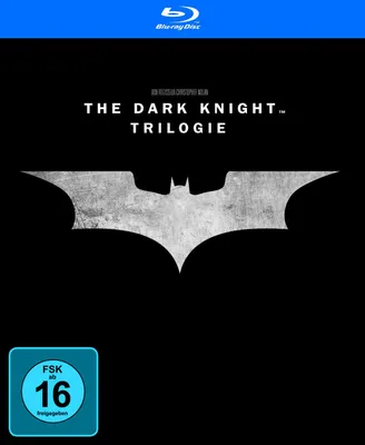 The image shows the cover art for 'The Dark Knight Trilogy' Blu-ray collection, featuring the Batman logo and age rating.