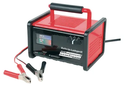 A red and black car battery charger with a digital display and attached clamps.