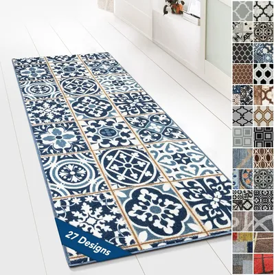 A long runner rug with a tiled pattern is laid out on a white wooden floor.