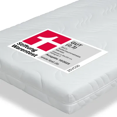 A white mattress with a label showing test results.