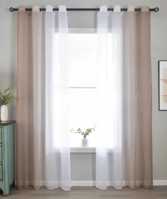 A window with curtains and a small plant on the windowsill.