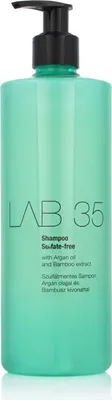 A product shot of a green shampoo bottle with a black pump dispenser, set against a white background.