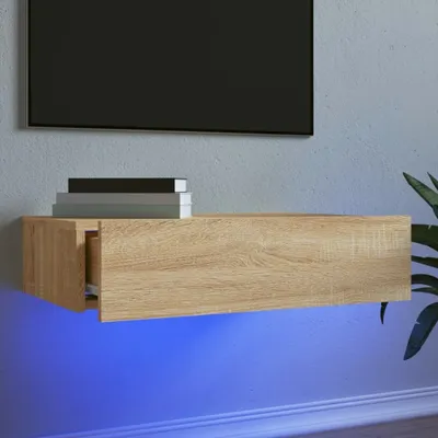 A floating media console with LED lighting underneath, mounted on a wall.