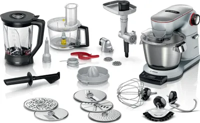 A collection of kitchen appliance attachments and a stand mixer are displayed on a white background.
