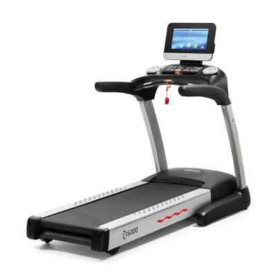 A studio shot of a treadmill on a white background.