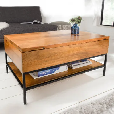 A wooden coffee table with a metal frame is shown in a living room setting.