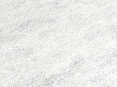 A close-up, textured view of a white material, likely fabric or felt.