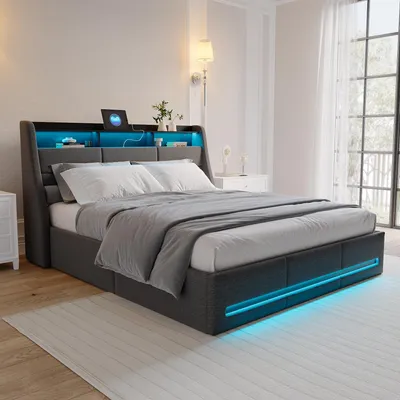 A modern bedroom with a gray upholstered bed featuring LED lighting and a headboard with storage.
