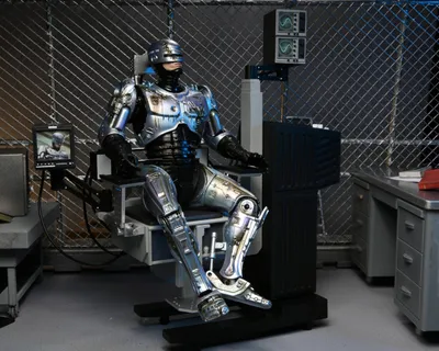 Obrázek produktu pro RoboCop Actionfigur Ultimate Battle Damaged RoboCop s křeslem 18 cm