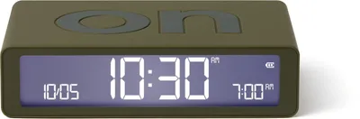 A digital alarm clock with a khaki-colored casing and a blue digital display.