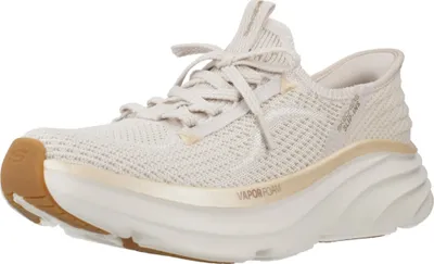 A single beige athletic shoe is shown against a white background.