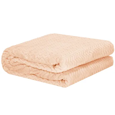 A folded peach-colored blanket with a textured pattern is shown against a white background.