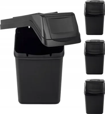 A black plastic trash can with its lid open, shown from the front. Three identical trash cans are visible on the right side of the image.