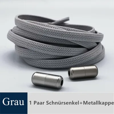 A coiled pair of gray elastic shoelaces with two silver metal aglets (tips) in the foreground, set against a light gray and white background. A text overlay in the bottom left corner indicates 'Grau' (Gray) and in the bottom center '1 Paar Schnürsenkel+Met