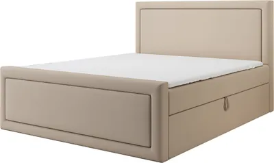 A studio shot of a beige boxspring bed with a headboard and two drawers.
