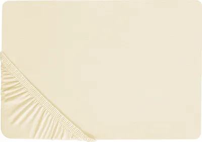 A flat lay of a yellow fitted sheet with elastic gathering visible at one corner.