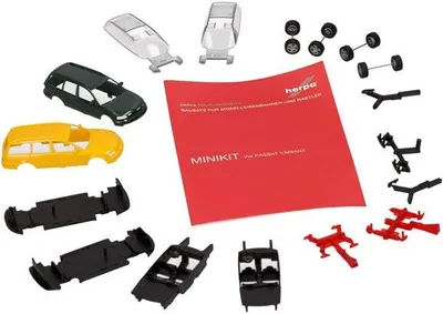 A collection of model car parts and instructions for a VW Passat Variant B5.