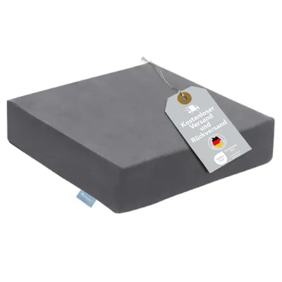 A gray seat cushion with a tag attached.