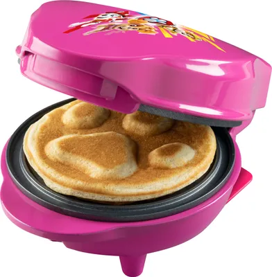 A pink Paw Patrol waffle maker with a waffle inside.