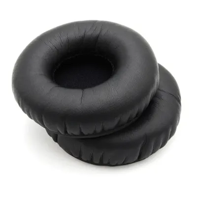 Two black ear pads for headphones are stacked on a white background.