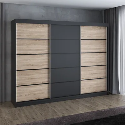 A modern sliding door wardrobe with a combination of dark gray and wood-effect panels, set against a concrete-effect wall and wooden floor.