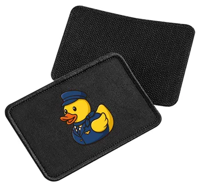 Produktbild von Huuraa Patch Quietscheente Stewardess Gummiente Flugbegleiterin Black 10 x 6,5cm Baumwolle Klettpatch für Mütze Geschenkidee