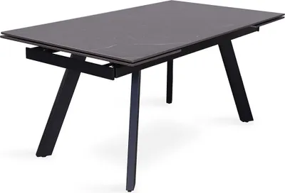Image de Table à manger extensible pour 10 personnes avec plateau en pierre noire collection LAROS. Structure en métal.
