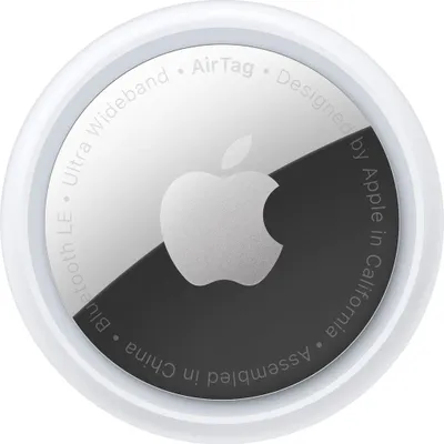 A close-up, top-down view of an Apple AirTag.